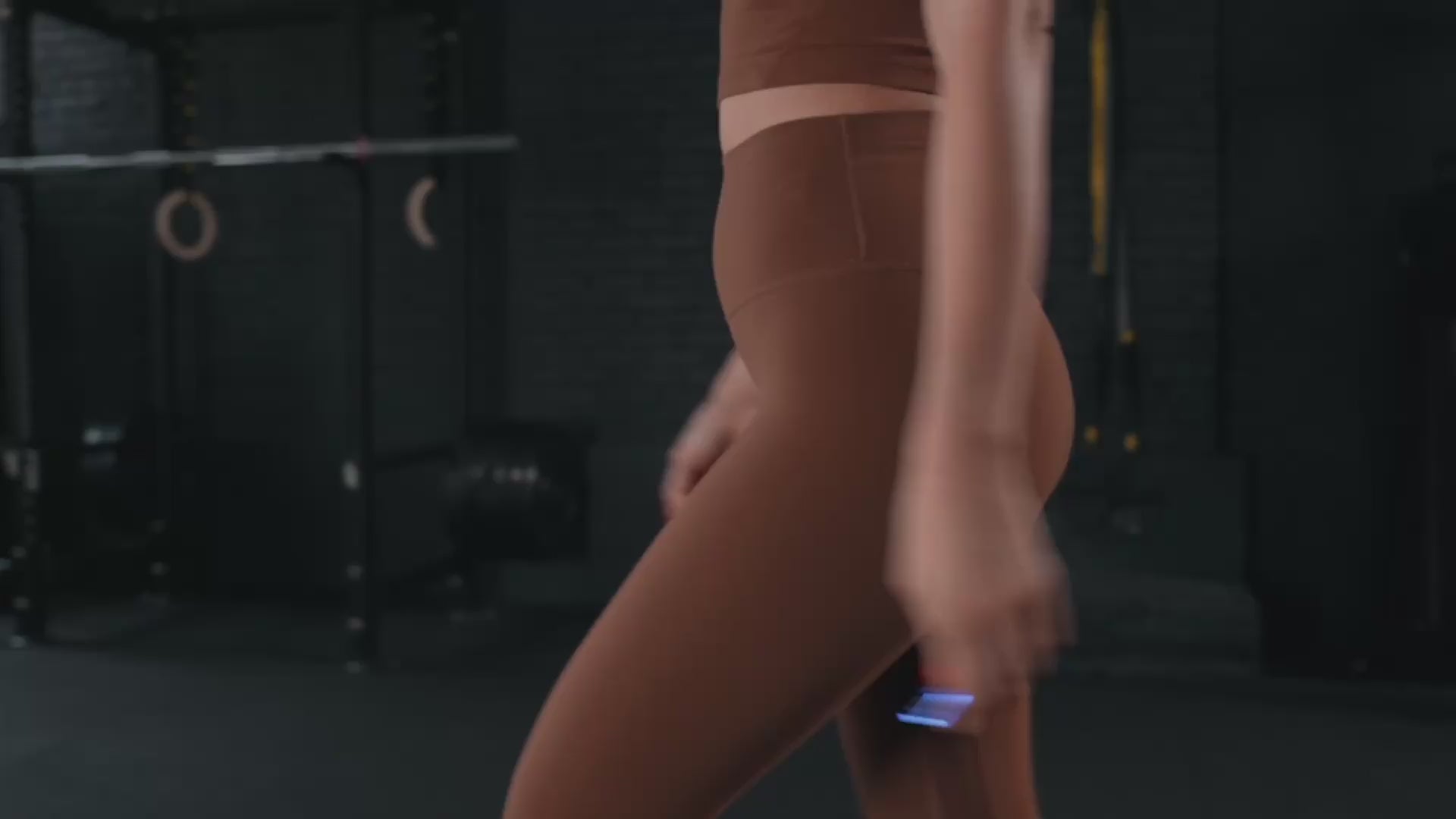 Load video: Woman performing kettlebell workout with Calibrex attached on the kettlebell.