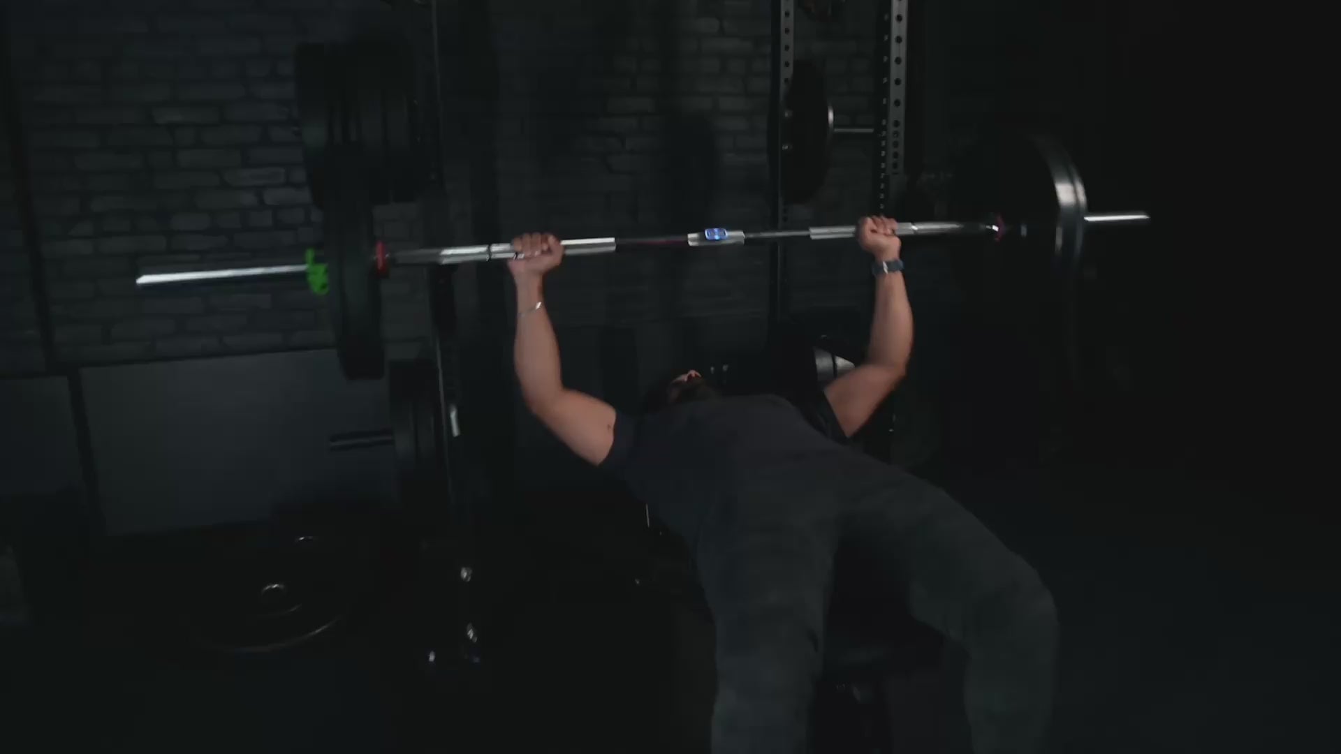 Load video: Man bench pressing with Calibrex and the Calibrex coach says he should take some weight off for the next set.